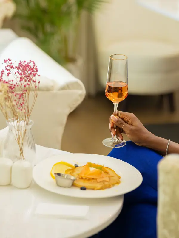 Smoked salmon pancake and a glass of bubbles